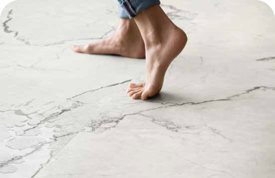 bare feet walking on marble floor tiles